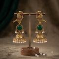 Antique Gold Parrot Jhumka Earrings with Green Stone & Pearl Drops